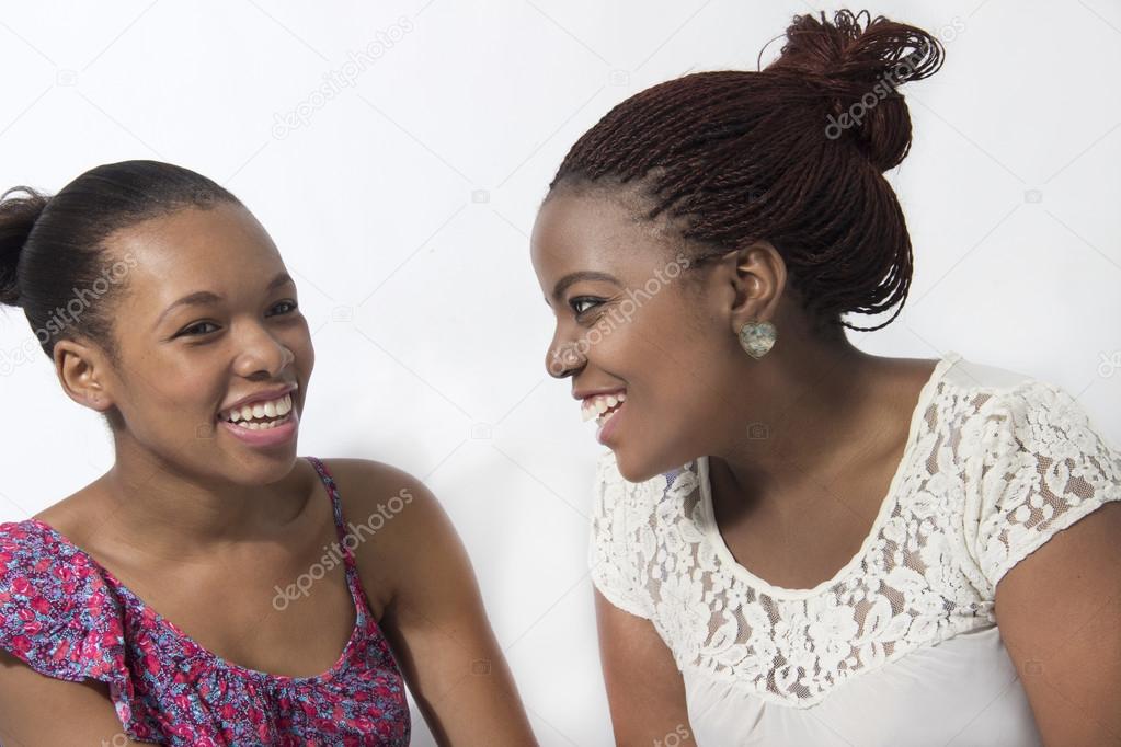 Beautiful Black Best friends joking and talking