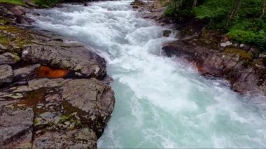 Beautiful river in wild nature of Norway near Aenes, slow motion