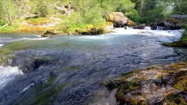 Beautiful river in wild nature of Norway near Aenes, slow motion