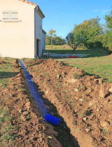 Trench for connection to the network of an individual house.