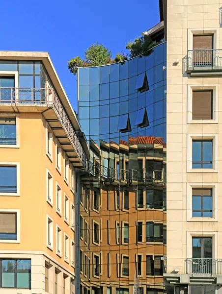 Modern glass architecture in a downtown alley