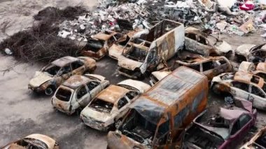 The war in Ukraine, the cemetery of burned civilian cars, Irpin, Kyiv region. Drone view, aerial view