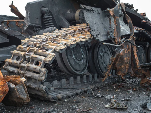 The war in Ukraine, a blown up tank, a torn hull, a broken tank chassis