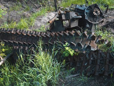War in Ukraine, a downed caterpillar from MTLB lies near a torn off engine