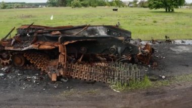 A destroyed tank, detonation of ammunition, a drone flies around a destroyed tank with a detached tower.