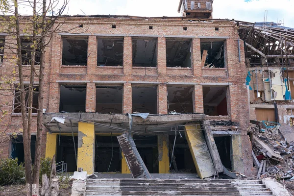 War in Ukraine, explosion-damaged building, windows blown out of the explosion