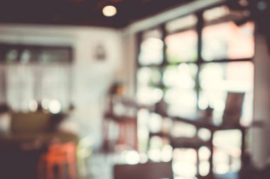 Bulanık kahve ve müşterilerin arka plan vintage ton renk tarzına sahip dinlendirici kafe.