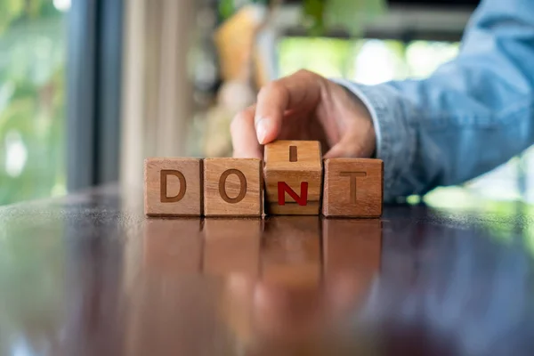 Woman Turns Wooden Cube Words Don Metaphor Making Decision —  Fotos de Stock