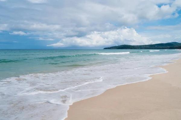 Tropical nature clean beach and white sand in summer with sun light blue sky.