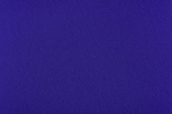 蓝色材料制成的背景 在深色阴影下缝制衣服用的织物 — 图库照片