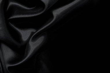 Sanat eserlerinin arka planı ve dekorasyonu için kumaşın koyu kumaş dokusunun bir parçası, güzel buruşmuş ipek ya da keten deseni. Buruşuk bir kumaş parçası.