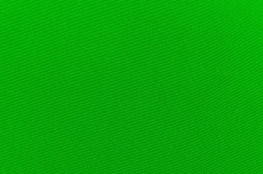 Yeşil kumaş arka plan. Tekstil. Terzilik için malzemelerin lüks dokusu