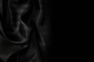 Sanat eserlerinin arka planı ve dekorasyonu için kumaşın koyu kumaş dokusunun bir parçası, güzel buruşmuş ipek ya da keten deseni. Buruşuk bir kumaş parçası.