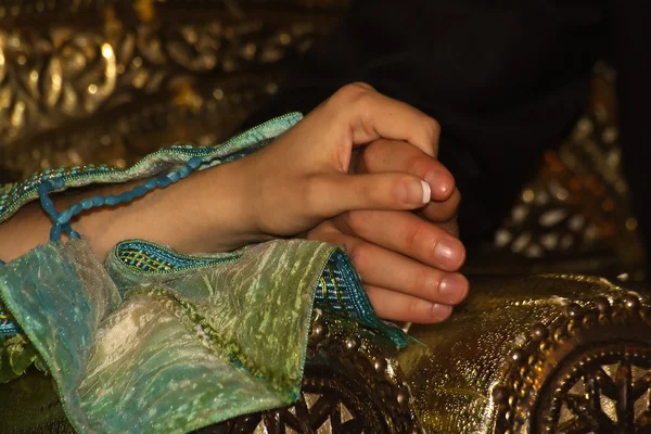 Holding hands at oriental wedding — Stock Photo, Image