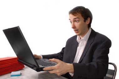 Young man freaks out in front of laptop clipart