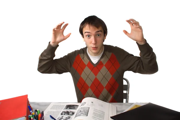 Student at table, overwhelmed — Stock Photo, Image