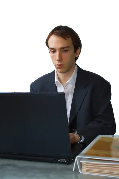 Young man works on laptop — Stock Photo, Image