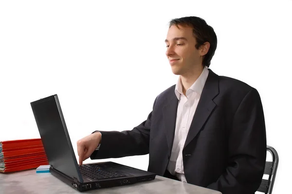 Young man proudly finishes work on laptop — Stock Photo, Image