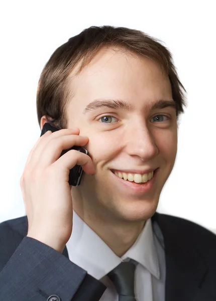 Fiatal szakmai mosolyt a telefonján — Stock Fotó