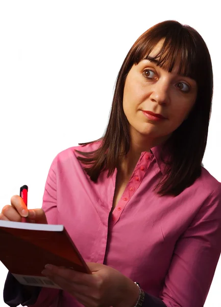 Woman takes notes and observes — Stock Photo, Image