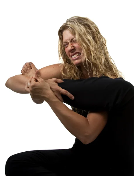 Woman stretches too hard and hurts herself — Stock Photo, Image