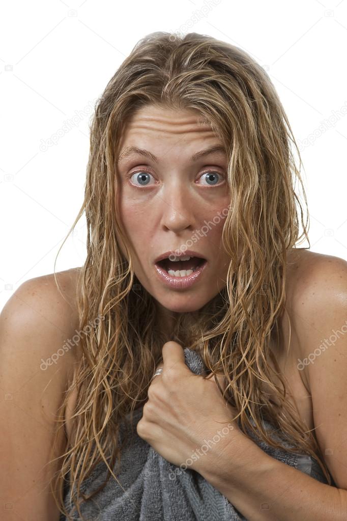 Closeup of woman gets out of the shower, surprised
