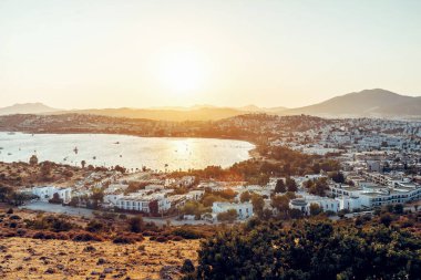 Panoramic view of Gumbet District of Bodrum, mediterranean city in Turkey on aegean coast in sunset. Toned image.