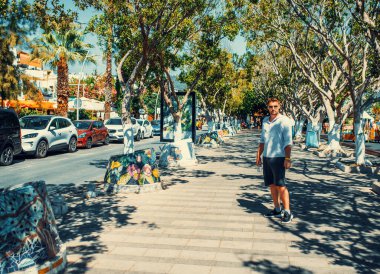 Bodrum, Turkey, 1st August 2022: Walk through Marina bay in city of Bodrum on aegean coast of Turkey. Toned image.
