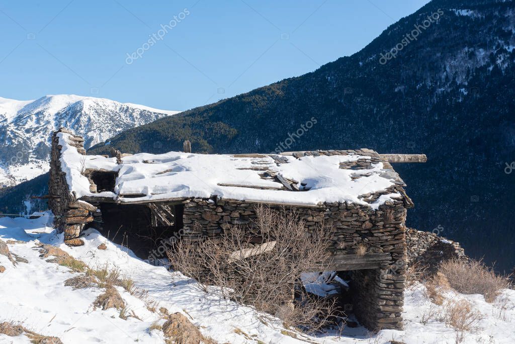 Ruins of old house in the Pyrenees of Andorra in Winter.