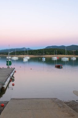 Montbel, France. 2022 August 2 . Sunset on Lake Montbel in Ariege with the boats in the summer of 2022.