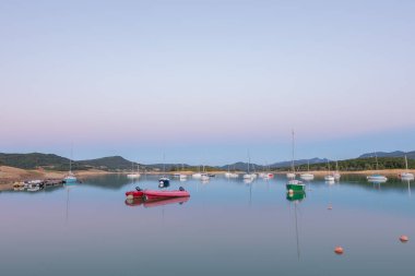 Montbel, France. 2022 August 2 . Sunset on Lake Montbel in Ariege with the boats in the summer of 2022.