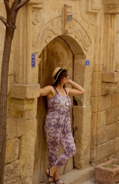 Beautiful young woman in old town, in Cappadocia, Turkey