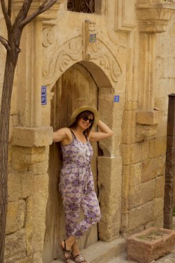 Beautiful young woman in old town, in Cappadocia, Turkey
