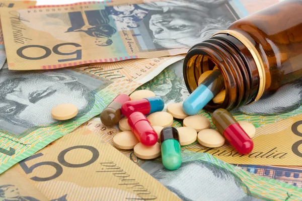 Píldoras y dólares australianos — Foto de Stock
