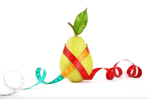 Tape measure wrapped around pear — Stock Photo, Image