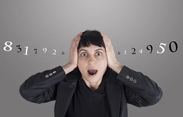 Confused woman with numbers around her head — Stock Photo, Image