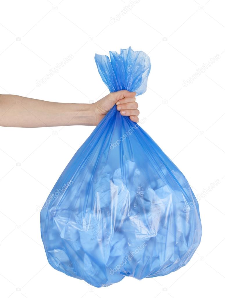 Close up of garbage bag holding by hand