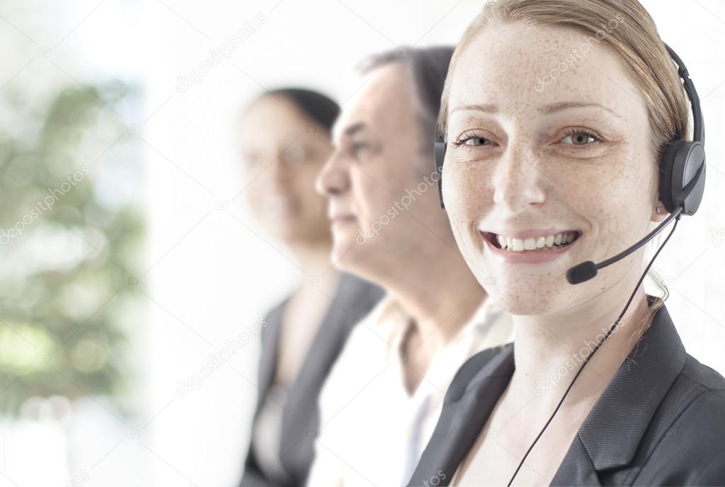 Happy customer support phone operator at office