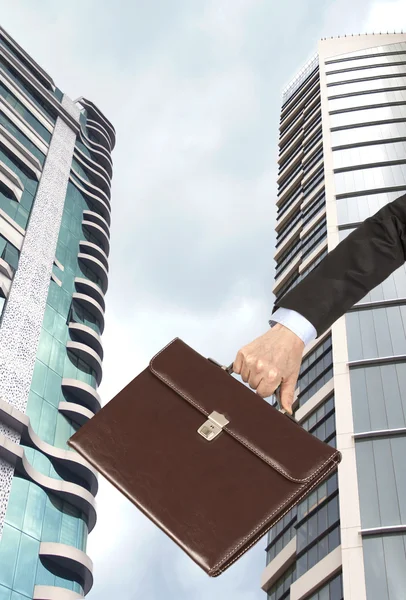 Businessman on skyscraper background — Stock Photo, Image