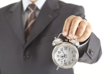 İş adamı saat tutuyor.