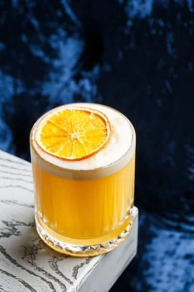Glass Yellow Cocktail White Foam Big Ice Cube Decorated Orange — стоковое фото