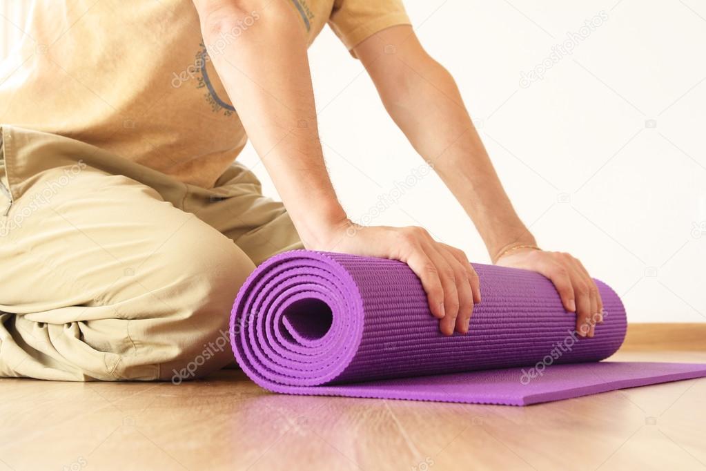 Man with yoga mat
