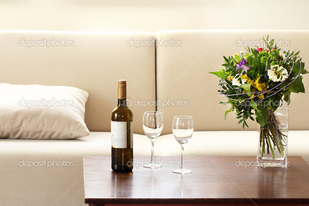 bottle of wine and glasses in living room