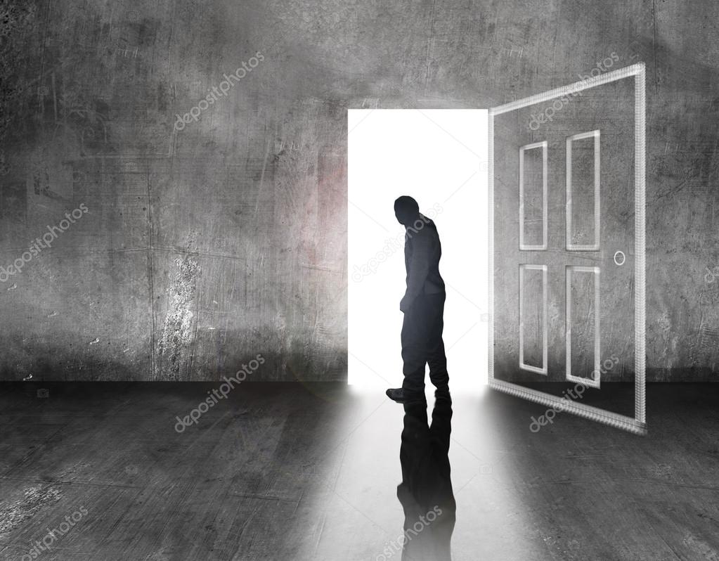 Person Walking In A Door Man Walking To Light Door Stock Photo