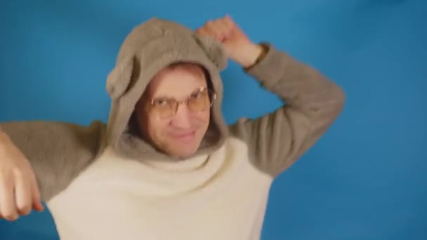 Man Hoodie Ears Glasses Dancing Blue Background Cheerful Male Having — Stock Video
