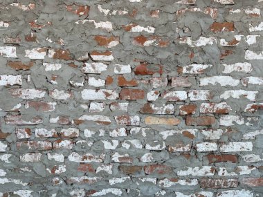 Betonlu tuğla dokusu. Eski duvarcılığın arka plan dokusu. Sert tuğla duvarı. Kapatın. Metnin için arkaplan kavramı