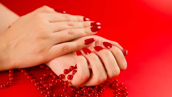 Crop Anonymous Woman Red Beads Red Manicure Red Background Studio — Stock Photo, Image