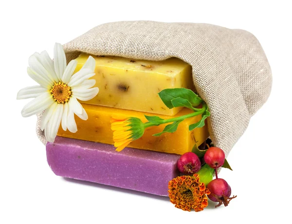 Soap in sack with flowers and berries — Stock Photo, Image