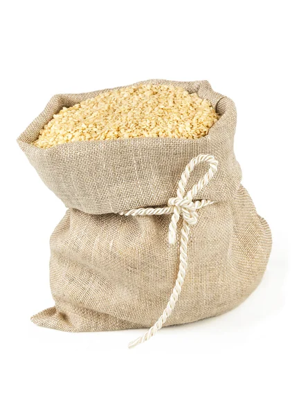 Sack with tie of sesame seeds — Stock Photo, Image