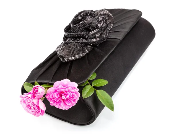 Rózsák fekete táska — Stock Fotó